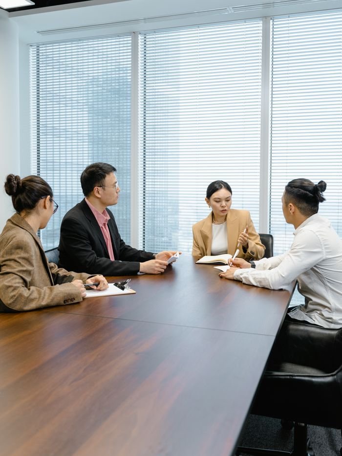 Group of colleagues collaborating in a modern office setting.